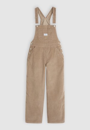 Hellbraune Corduroy-Latzhose mit verstellbaren Trägern, seitlichen Knöpfen und zwei Vorder-Taschen. Weiche Textur mit einem lässigen Schnitt.