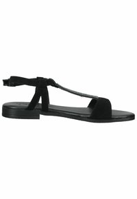 Black suede sandal featuring a flat sole, open-toe design, thin straps, and a decorative chain accent along the center strap.
