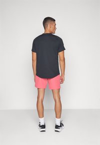 Nike Performance Sportiniai šortai - aster pink/black