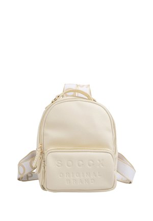 Small cream-colored leather backpack with front zip pocket and wide white straps featuring beige text.