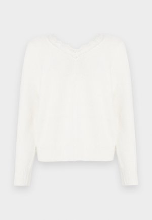 Suéter blanco de punto con escote en V y borde de encaje. Presenta mangas largas, puños acanalados y un dobladillo ligeramente corto. Tejido suave y texturizado.