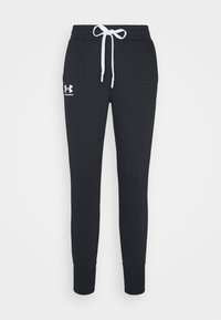 Svarta sweatpants i bomullsmix, med dragsko i midjan, ribbade muddar och en vit logo på vänstra låret.