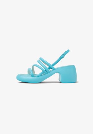 A blue sandal with a rounded toe, three thin straps, and a chunky heel. The material appears smooth with a subtle sheen.