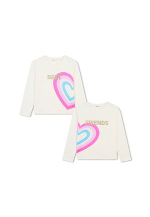 Camicie bianche a maniche lunghe con grafiche a forma di cuore rosa, blu e acqua; "BEST" e "FRIENDS" in testo glitterato oro. Texture in cotone morbido.