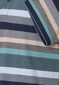 Polo shirt featuring horizontal stripes in navy, teal, beige, and light blue. Contrast collar in solid teal with ribbed texture.