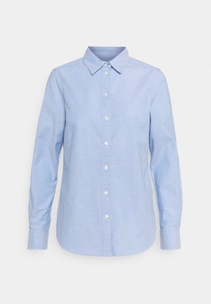 Light blue long-sleeve button-up shirt with pointed collar and buttoned cuffs, displayed on a plain light background.