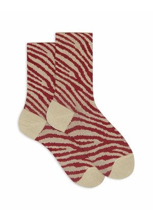 Calzini a righe rossi e beige con motivo a zebra, con tallone e punta rinforzati in beige, realizzati in un morbido materiale lavorato a maglia.