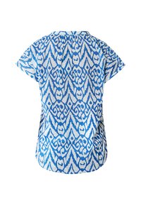 Blusa a maniche corte blu e bianca con motivo geometrico, bordo curvo e piega posteriore per maggiore volume.