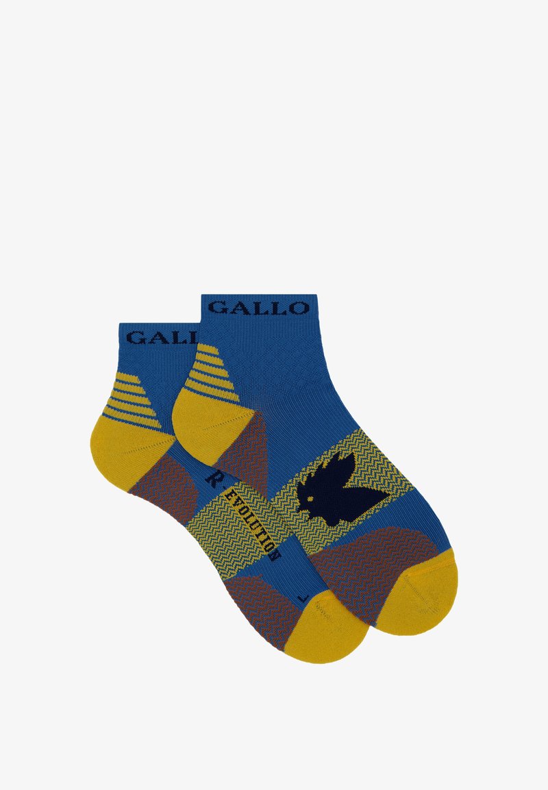 Calzini alla caviglia blu e gialli con un motivo a zigzag, caratterizzati da un design di un uccello nero. Il nome del marchio "GALLO" è tessuto sul bordo.