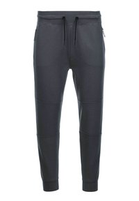 Pantalones de chándal gris oscuro fabricados en tejido suave, con cintura elástica ajustable, dos bolsillos laterales con cremallera y detalles en panel en las piernas.