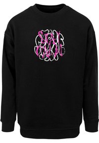 Felpa nera con polsini e orlo a costine. Presenta una grafica testuale in bianco e rosa con la scritta "STAY CALM" in un font circolare.