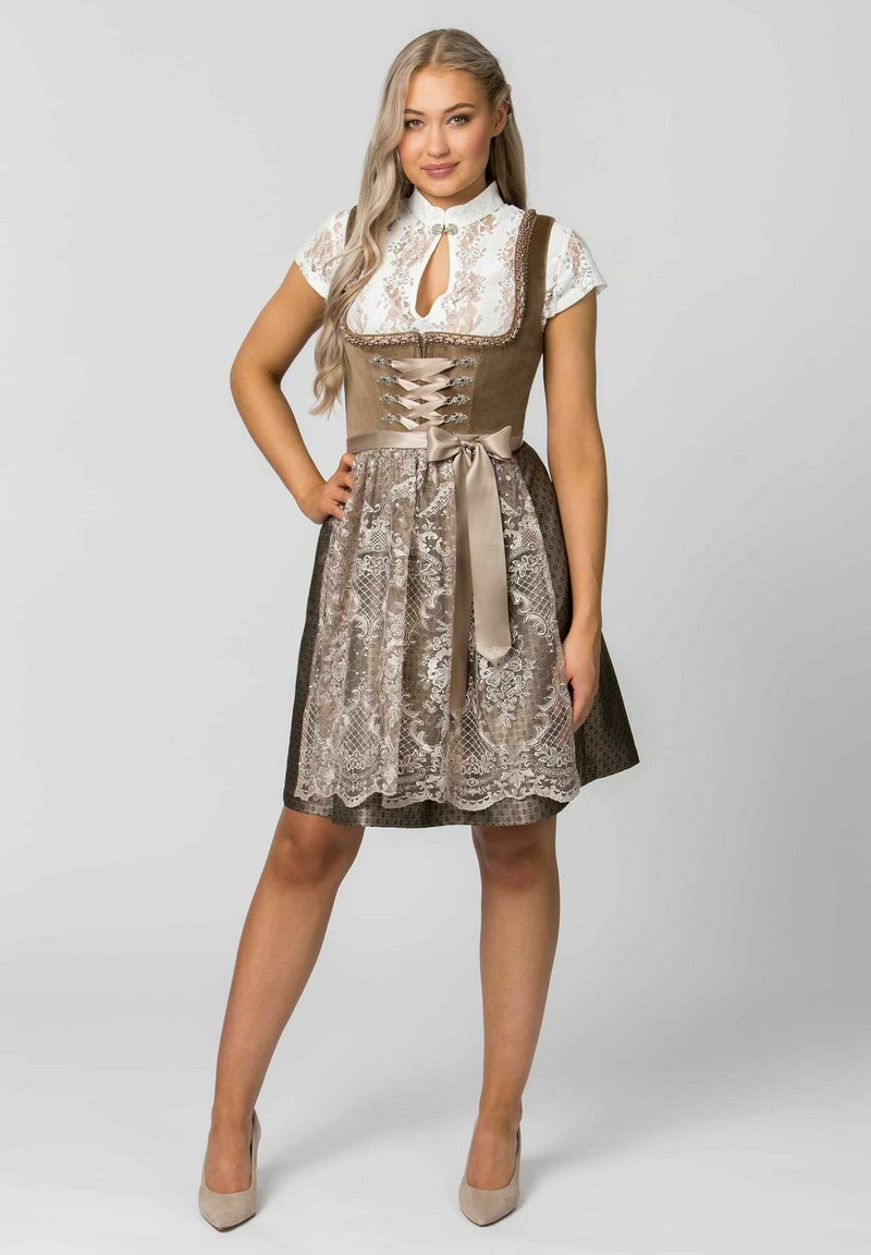 Brown and beige dirndl dress with lace bodice, short sleeves, lace trim, bow at waist, and patterned skirt. High neckline with keyhole detail.