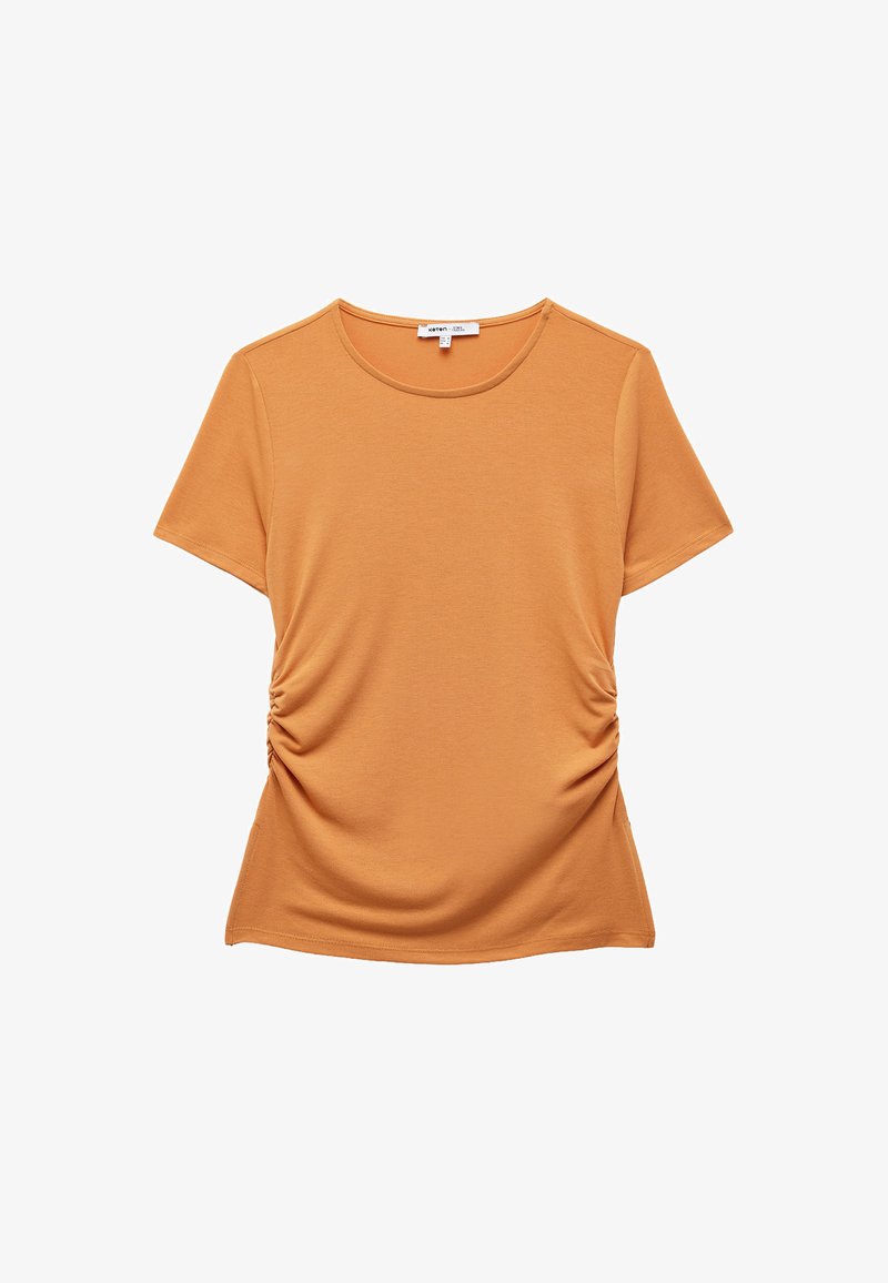 Kortærmet sennep-orange t-shirt med rund hals og detaljeringspunkter i siden, lavet af blødt, let stof. Glat overflade hele vejen igennem.