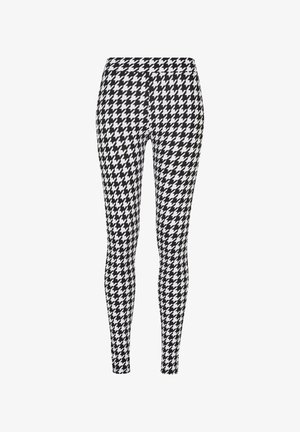 Svart-hvitt houndstooth-mønstret leggings, figursydd design, elastisk materiale, glatt tekstur og smale ben.