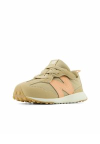 Beige and peach toddler sneaker with Velcro strap, laces, textured sole, and cushioned tongue, isolated on white background.