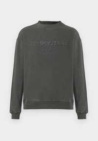 Sudadera gris de algodón, con cuello redondo, puños de canalé y logo bordado "TOMMY JEANS" de estilo vintage.
