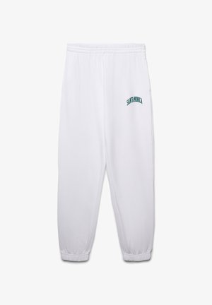 Pantaloni sportivi bianchi con vita elasticizzata e polsini elastici. Presentano la scritta "SANTA MONICA" ricamata in turchese sul lato sinistro. Tessuto morbido.