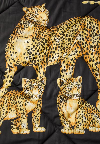Black fabric featuring a bold leopard print in yellow and orange. Two leopards and a cub are illustrated with distinctive spotted patterns.