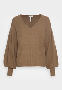 Bruine geribbelde trui met V-hals, volumineuze ballonmouwen en een textuurpatroon. Voorzien van een aansluitende onderzoom en manchetten.