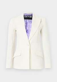 Λευκό σακάκι με ένα κουμπί, γιακά με χαραγή, τσέπες με καπάκι και μωβ εσωτερική φόδρα με σχέδιο, με ετικέτα Versace Jeans Couture.