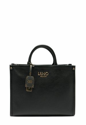 Sac en cuir noir avec une forme rectangulaire structurée, deux poignées supérieures, un logo doré et une étiquette de verrou décorative avec un motif monogramme.