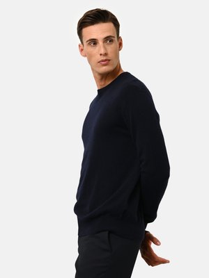 Maglione a maglia blu navy con scollatura rotonda e maniche lunghe, realizzato in tessuto morbido. Presenta una vestibilità comoda e un orlo a coste.