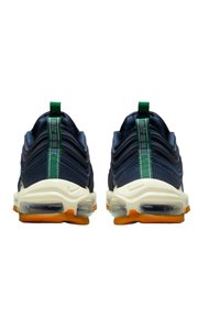 Navy blue athletic shoes with textured upper, clear air cushioning, cream midsole, and orange outsole. Features green heel tab and branding.