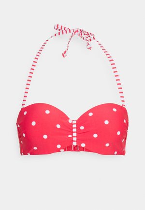 Rood met stippen bikini top met gevoerde cups, een strikdetail in het midden en verstelbare gestreepte halterbandjes. Haaksluiting aan de achterkant.