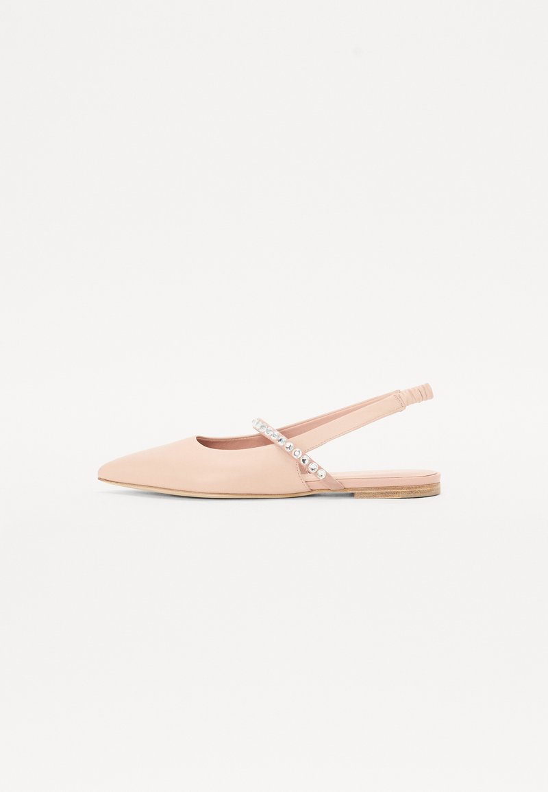 Pointed-toe slingback flats in soft pink leather, featuring a decorative strap with metallic studs and a low wooden sole.