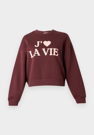 Bordeauxfarvet cropped sweatshirt med teksten "J' ♥ LA VIE" i lyserød. Den har ribbede manchetter og rund halsudskæring, lavet af et blødt materiale.