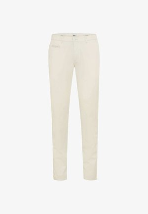 Cremefarbene, schmal geschnittene Hose mit Gürtelschlaufen, vorderem Knopf- und Reißverschluss sowie einer kleinen Reißverschlusstasche auf der rechten Seite.