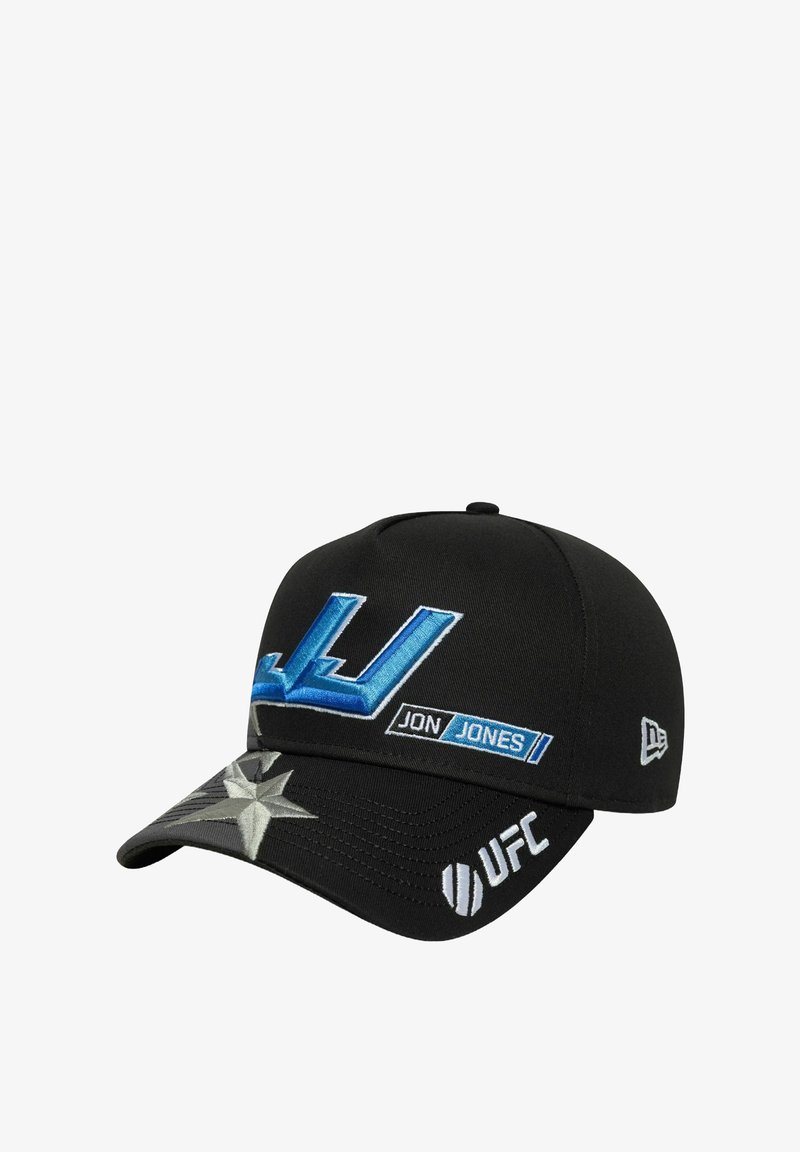 Black baseball cap featuring blue embroidered "JJ" logo, "JON JONES" label, and silver star detail on the visor, with UFC branding.