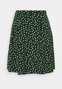 Jupe verte à pois blancs, dotée de plis et d'une forme évasée. Fabriquée en tissu doux, elle possède une taille pour un maintien sécurisé.