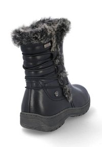 Botines negros de invierno con forro de pelo sintético gris, etiqueta de resistencia al agua, diseño con cordones y suela texturizada para mayor tracción.