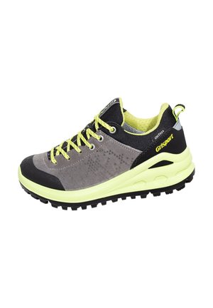 Gray and black athletic shoe with yellow laces and accents, featuring a textured upper and rugged black sole for outdoor traction.