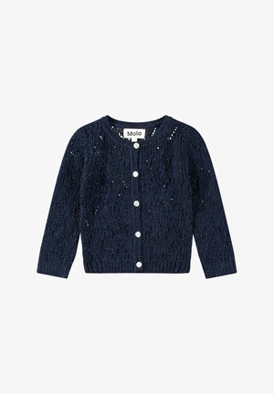Marineblå strikket pige cardigan med lange ærmer, rund halsudskæring, hvide knapper foran og mærketiketten "Molo" indeni kraven.