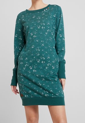 Turkusowa mini sukienka z długim rękawem, ozdobiona małym białym kwiatowym wzorem, z prążkowanymi mankietami i dołem oraz trzema dekoracyjnymi guzikami przy dekolcie.