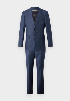 Costume bleu marine avec une veste ajustée et un pantalon droit. Fabriqué en tissu texturé avec un motif à carreaux subtil et deux boutons à l'avant.
