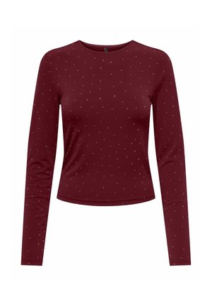 Haut ajusté à manches longues couleur bordeaux avec de petits pois blancs répartis uniformément sur le tissu.