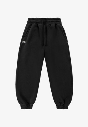Schwarze Jogginghosen mit elastischem Bund und Bündchen, Seitentaschen, Kordelzug und kleinem weißen "SRF" Logo auf dem linken Oberschenkel.