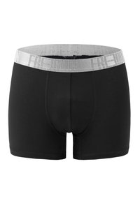 Black boxer shorts with a soft elastic grey waistband featuring the text "FREEDOM". Smooth fabric and fitted design with seamless edges.