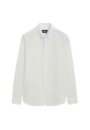 Bílá košile s dlouhým rukávem na knoflíky, vyrobená z hladké bavlny; má klasický límec, zapínání na knoflíky a zaoblený lem. Minimalistický design.