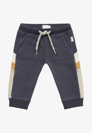 Pantalon de survêtement marine avec poignets et taille côtelés. Poches avant, cordon ajustable vert clair, et panneaux latéraux contrastants beige et orange.