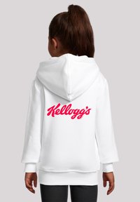 Weißer Hoodie mit einem großen roten "Kellogg's"-Logo auf dem Rücken, mit einer weichen Stoffqualität und einem geräumigen Kapuzen-Design.