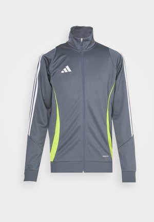 Grå atletisk jakke med høj krave, hvide striber på ærmerne og limegrønne detaljer. Fremstillet af glat, elastisk stof.