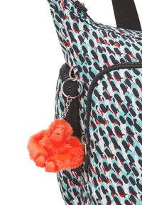 Textile shoulder bag with a blue, black, and red pattern. Features black zipper with silver hardware, and an orange monkey plush keychain.