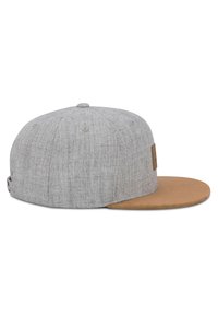 Gray fabric baseball cap with a tan suede brim, featuring a textured finish and a small logo patch on the side.