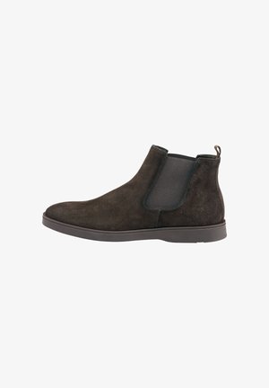 Dunkelbraune Wildleder Chelsea-Boots mit elastischen Seiteneinsätzen, runder Spitze und strukturierter Gummisohle. Zuglasche an der Rückseite für ein einfaches Anziehen.