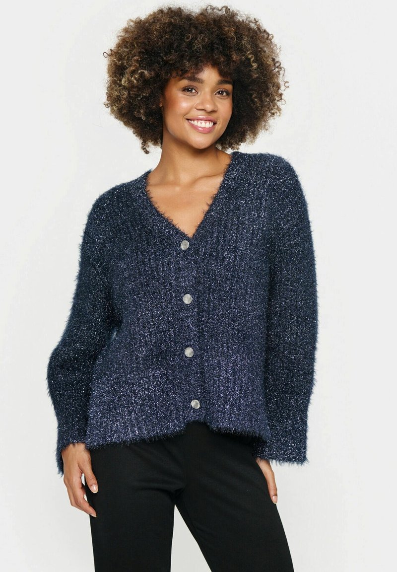 Navy blue fluffy cardigan with a v-neck, long sleeves, and four metallic buttons down the front. Soft texture and loose fit.