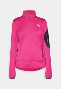 Růžová fleecová bunda se zipem vpředu, vysokým límcem, černým ramenním panelem a dvěma bočními kapsami. Na hrudi se nachází logo.